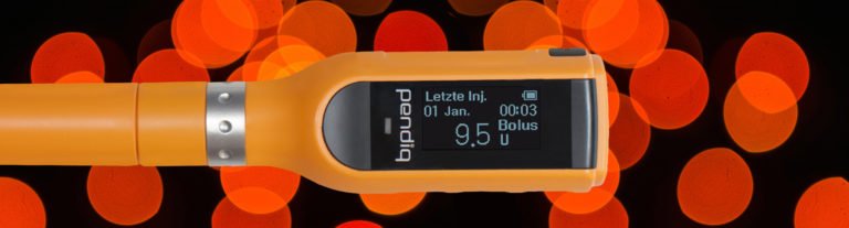 pendiq 2.0 Insulinpen orange vor funky Hintergrund